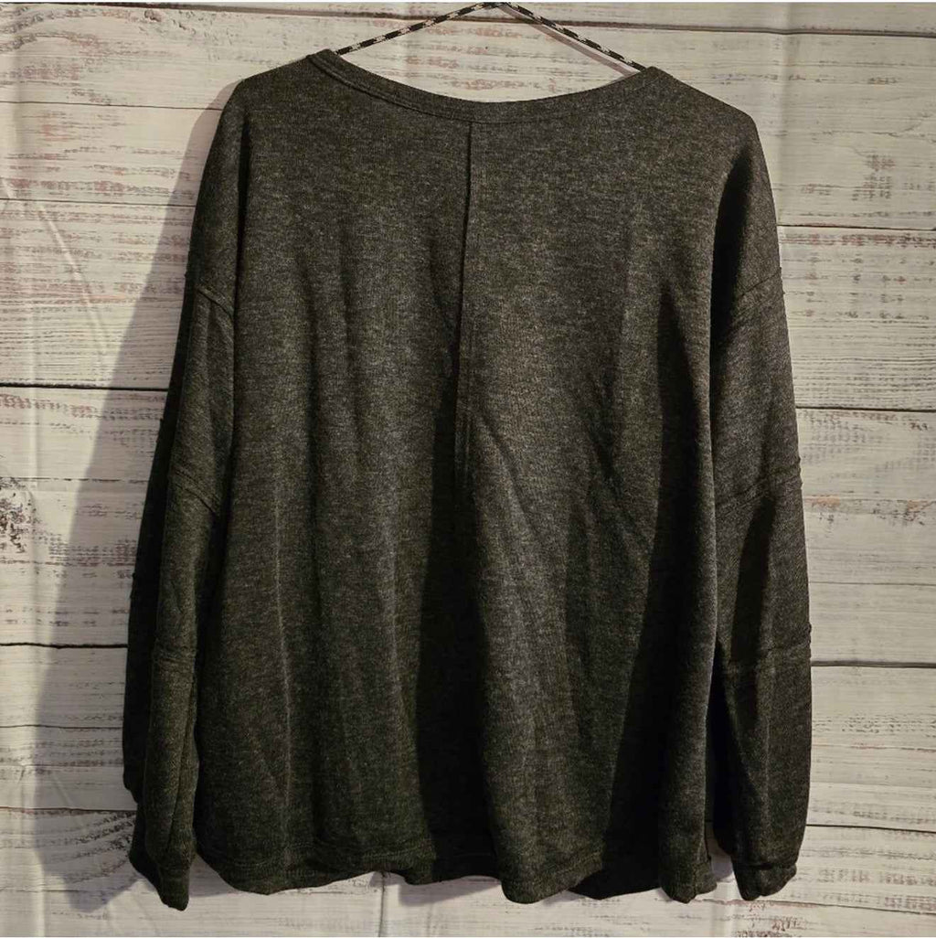 Gray oversized long-sleeve top side view