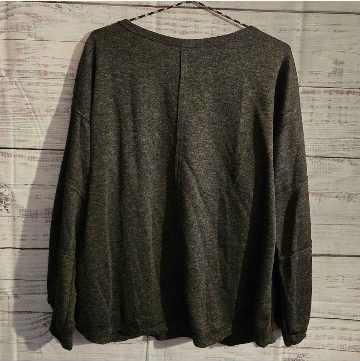 Gray oversized long-sleeve top side view