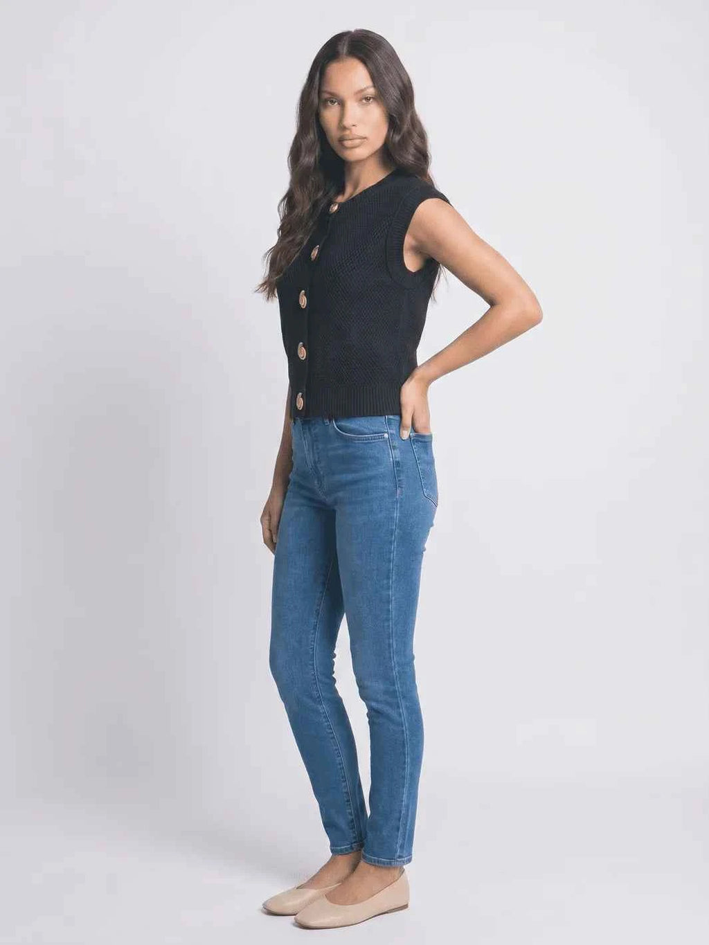 Black sleeveless layering vest side view