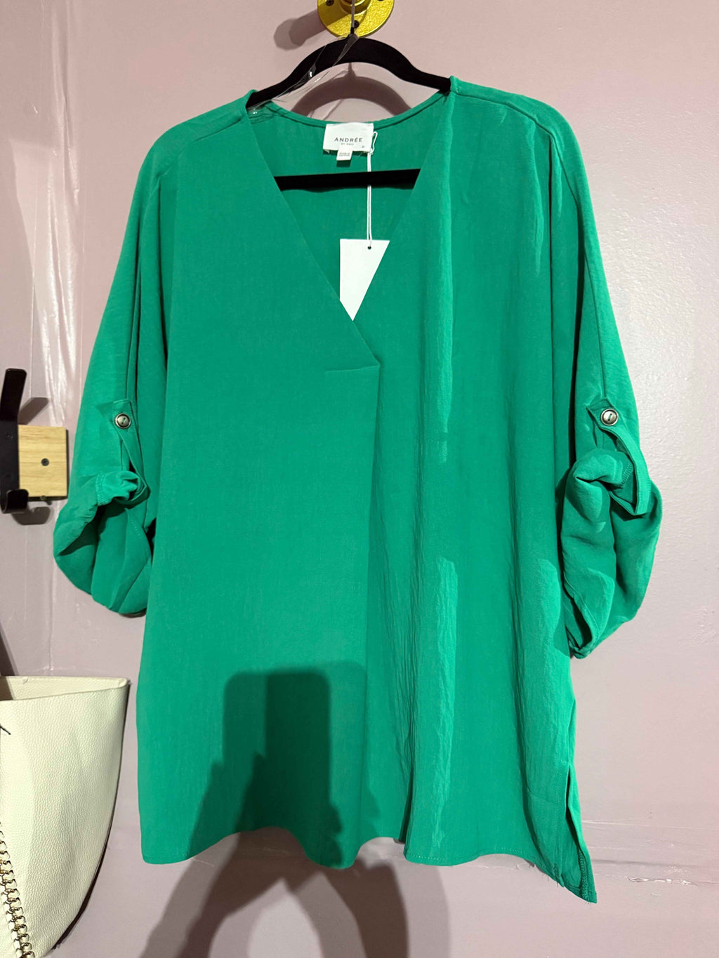 Plus-size emerald green V-neck blouse detail view