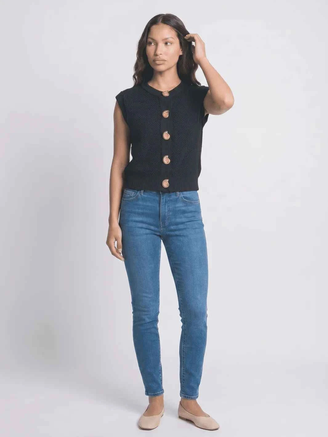 Black round-neck knit vest styled view