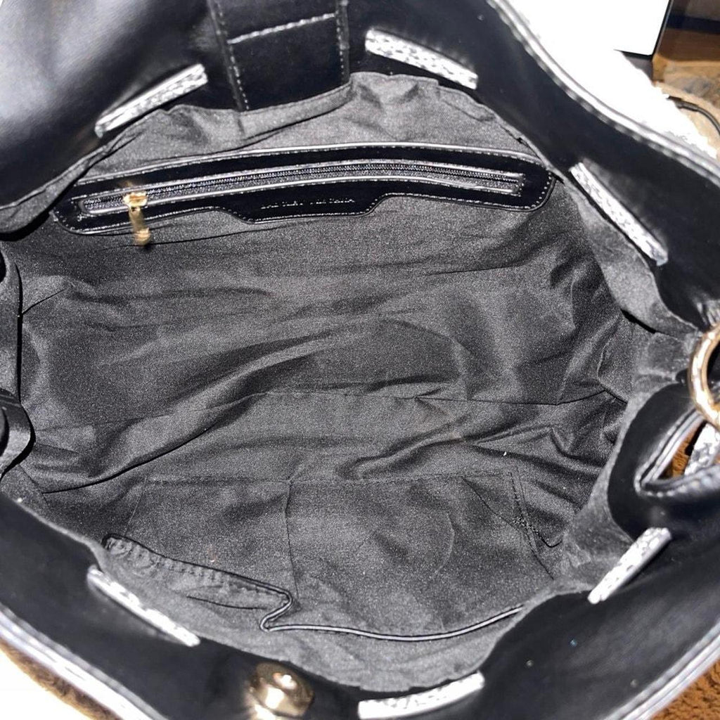 Interior of Badgley Mischka black tote with zip pocket