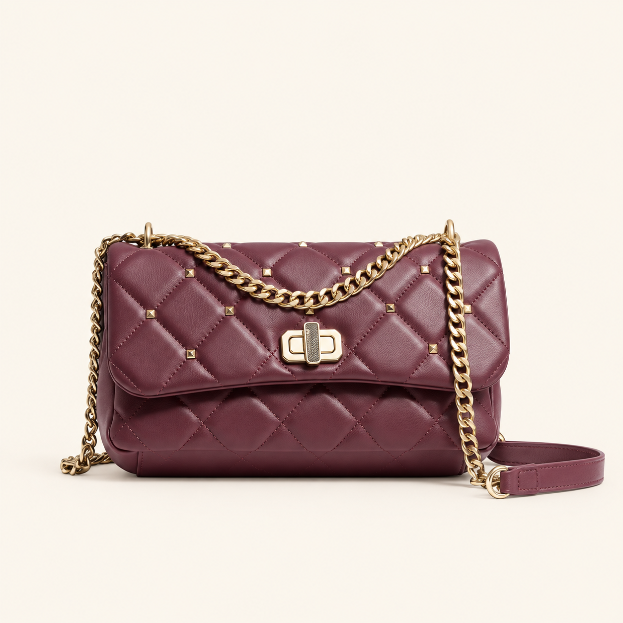 Badgley Mischka burgundy quilted messenger bag with braided gold chain front view