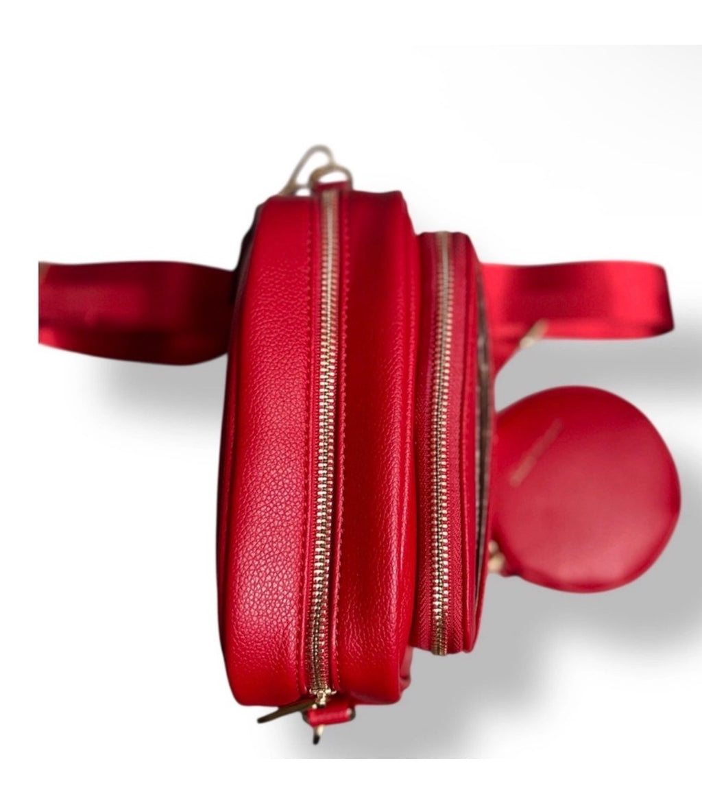 Side view of Christian Lacroix red camera bag and matching coin purse