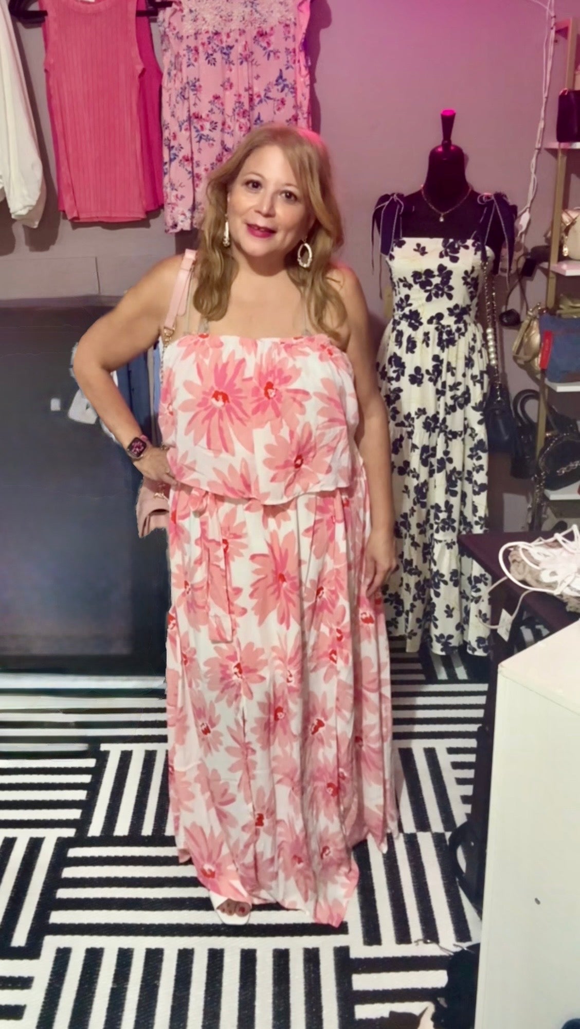 Caroline modeling the Emily Wonder pink floral strapless maxi dress in size 1X