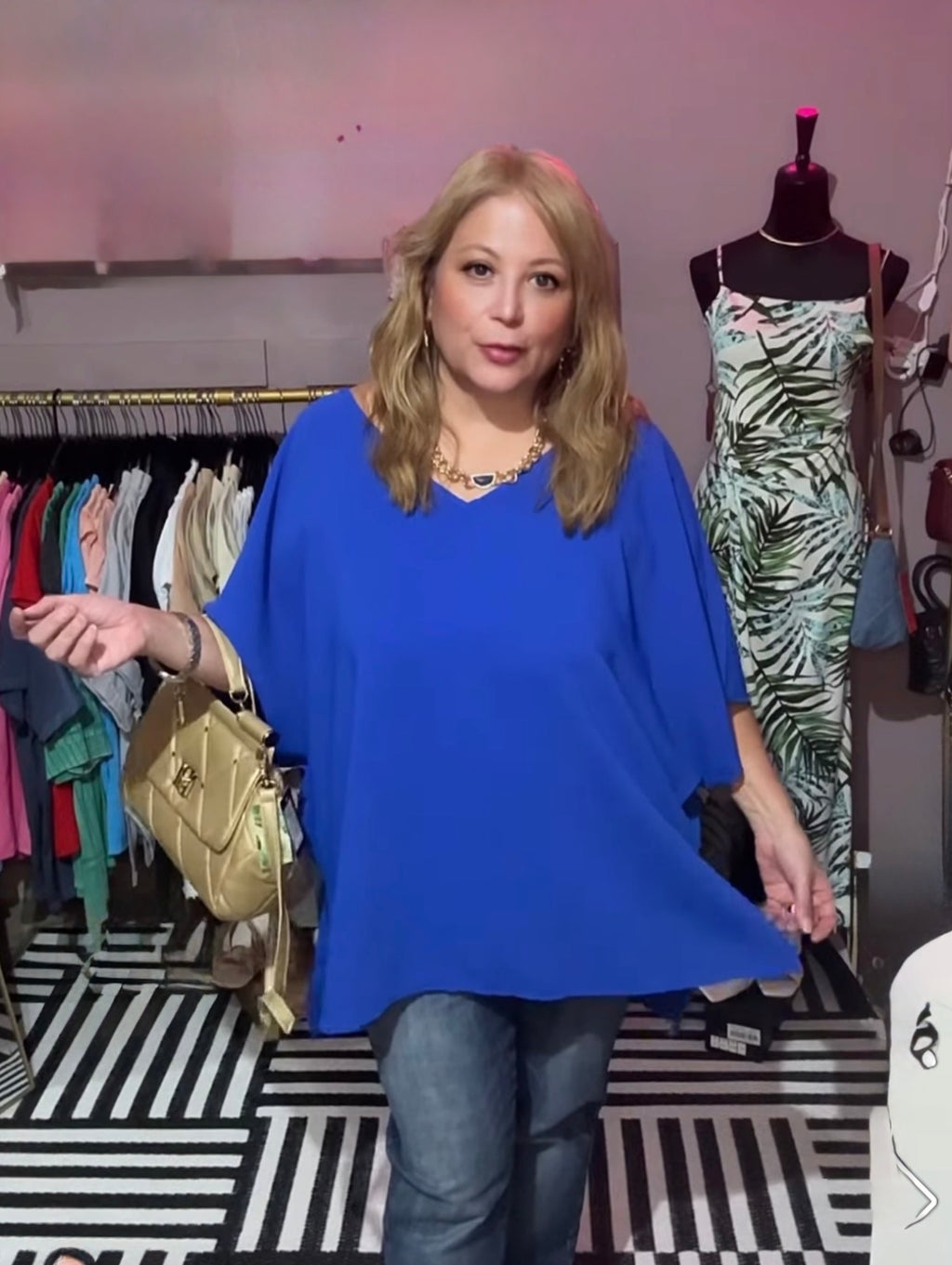 Caroline wearing the plus-size royal blue dolman V-neck blouse