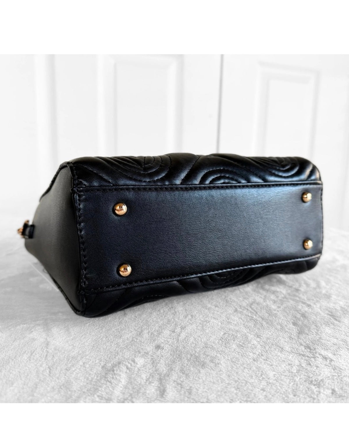 Valentino Orlandi black quilted tote protective feet and base