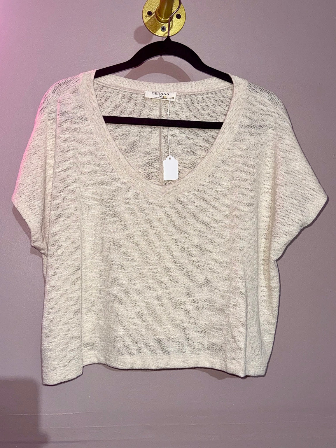 Original hanger photograph showing the Zenana top's textured knit, V-neckline and short sleeves